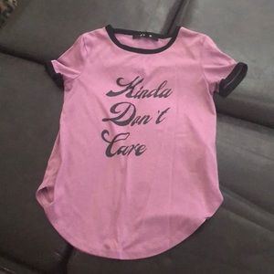 A purple shirt with “kinda don’t care”